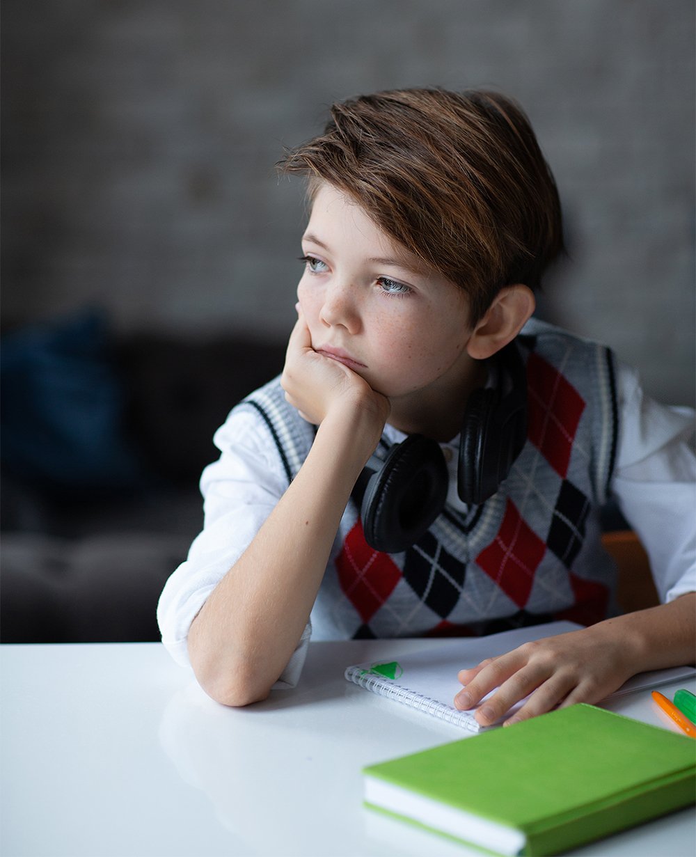 boy daydreaming in school